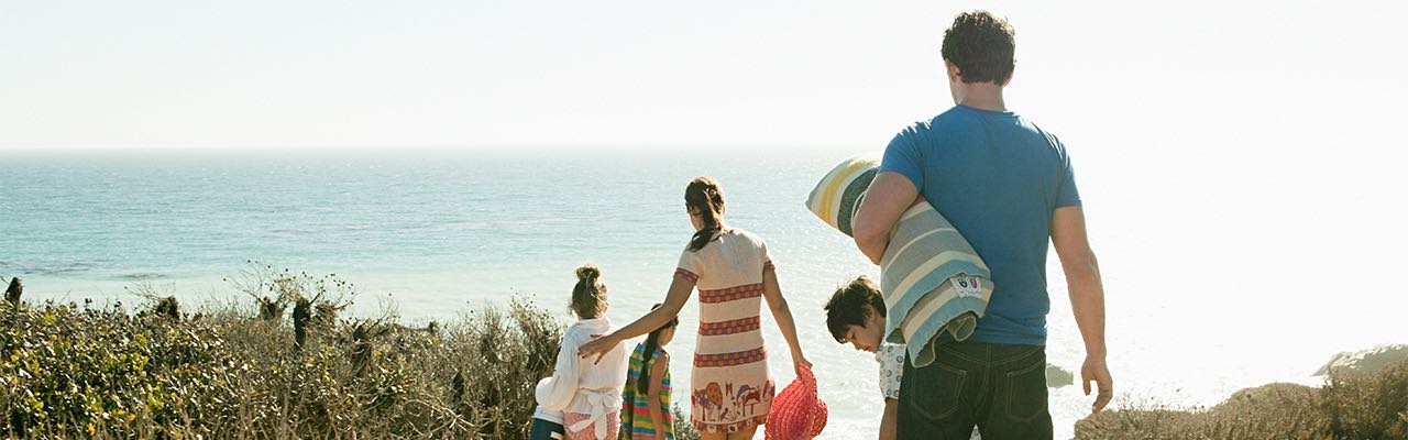 Family walking to the beach